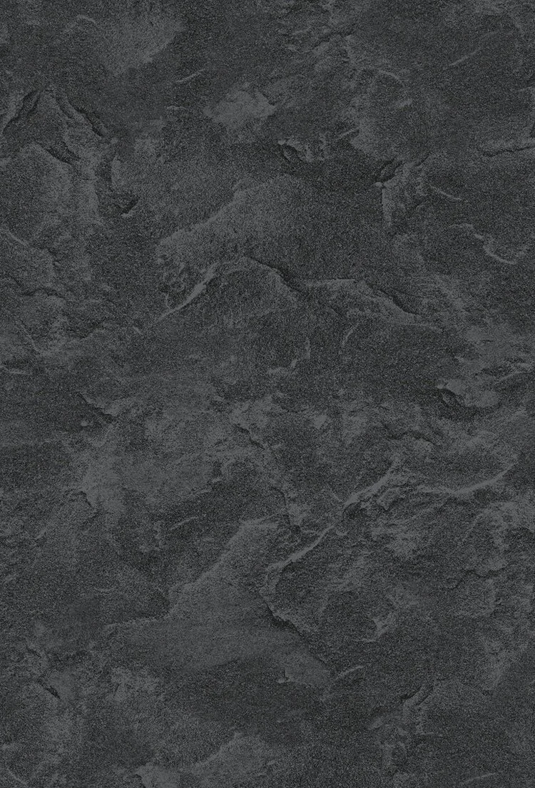 Close-up view of a dark gray textured stone surface.