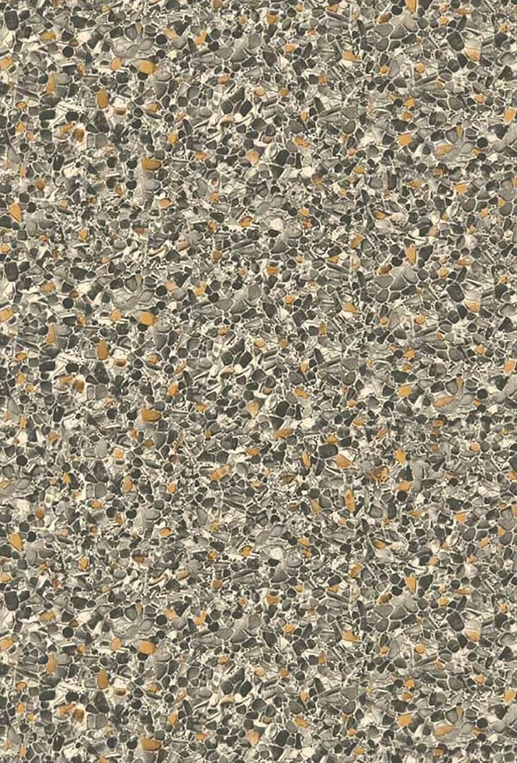 Close-up of a textured surface with small, irregularly shaped stones in black, gray, white, and tan colors.