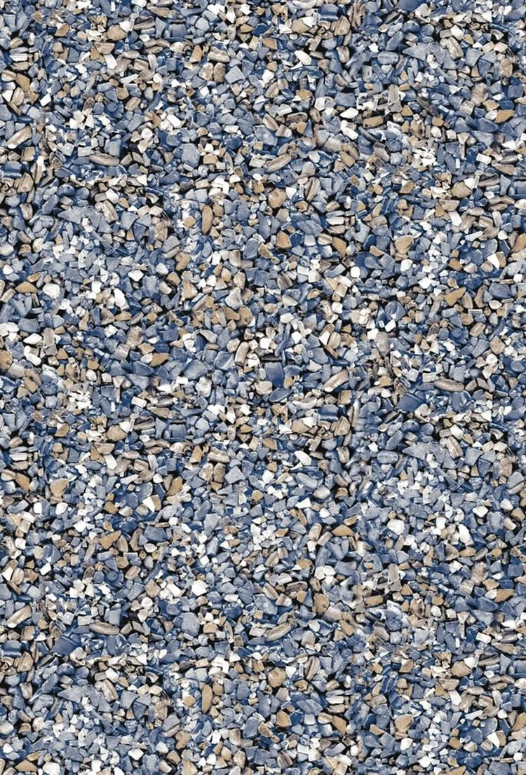 Close-up view of a gravel surface with small rocks in gray, beige, and white colors.