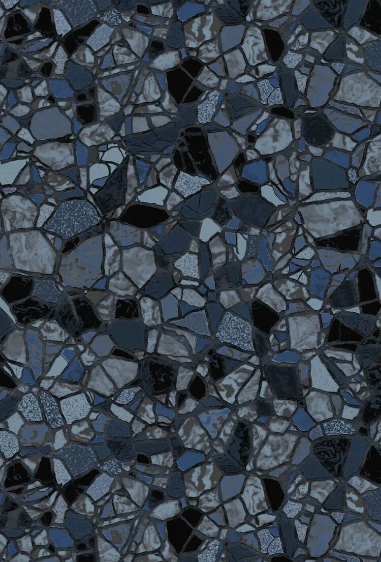 A close-up of a dark, multicolored terrazzo floor with irregular stone pieces in black, gray, and blue.
