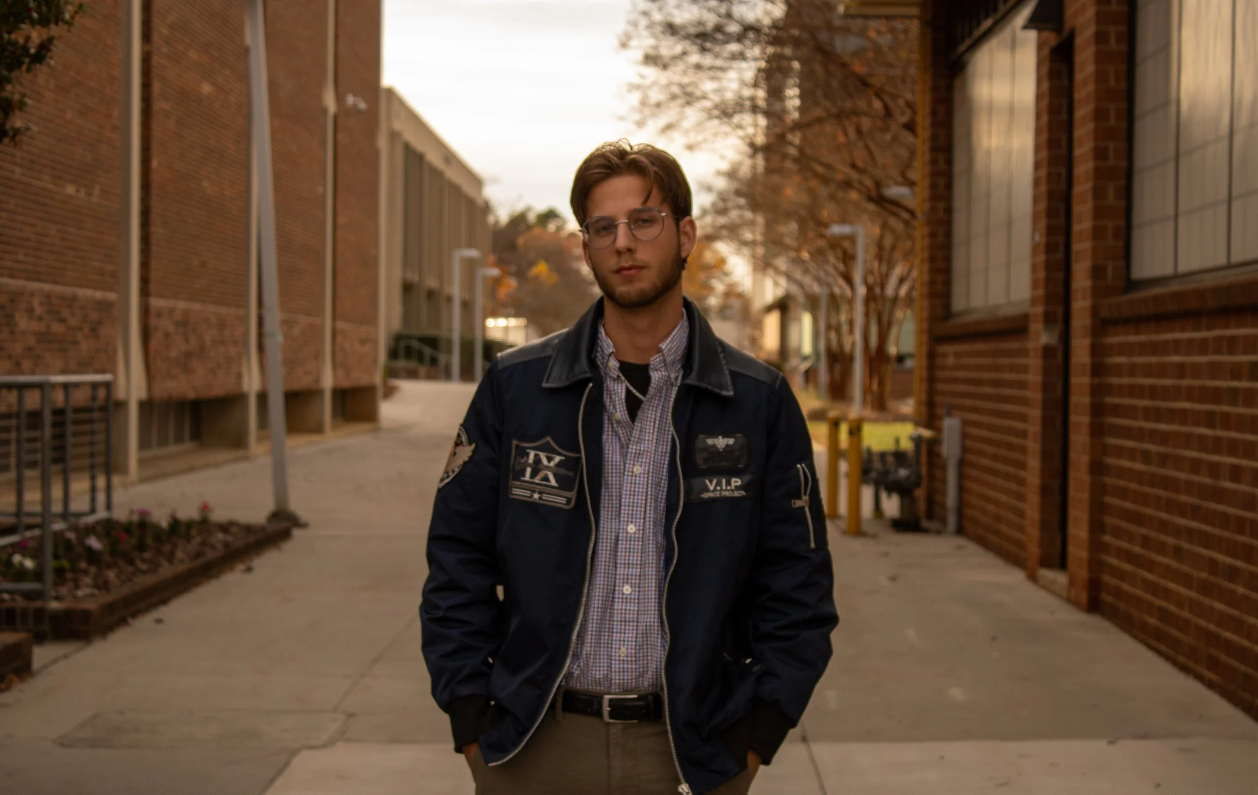 Portrait of a man in between buidlings