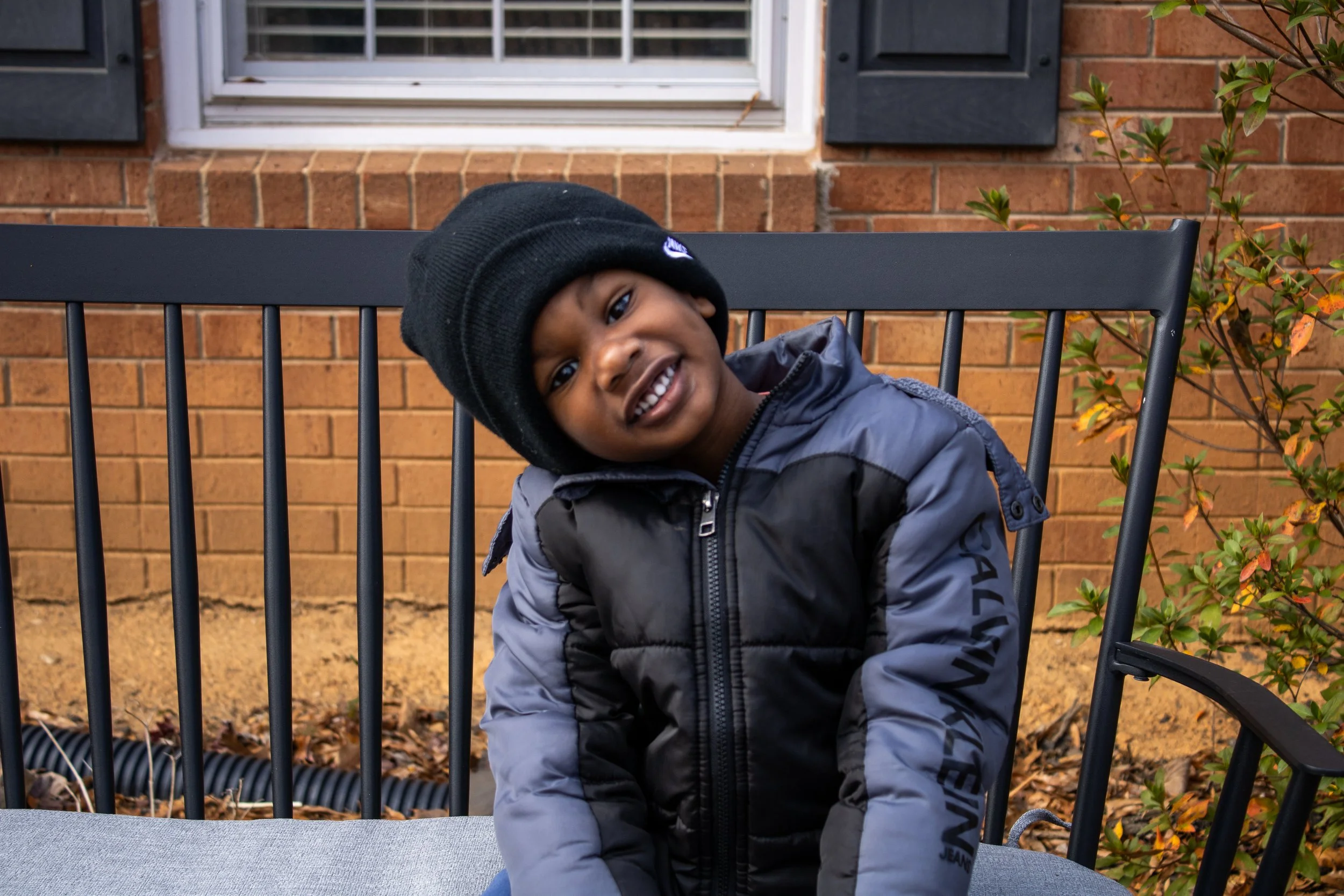 Portrait of a little boy smiling outdoors