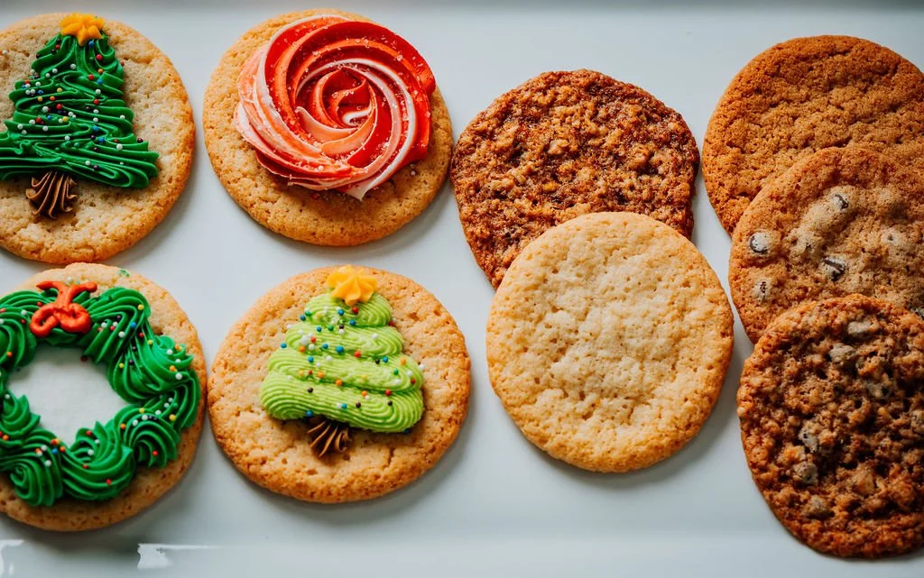 Assorted cookies on a white platter.