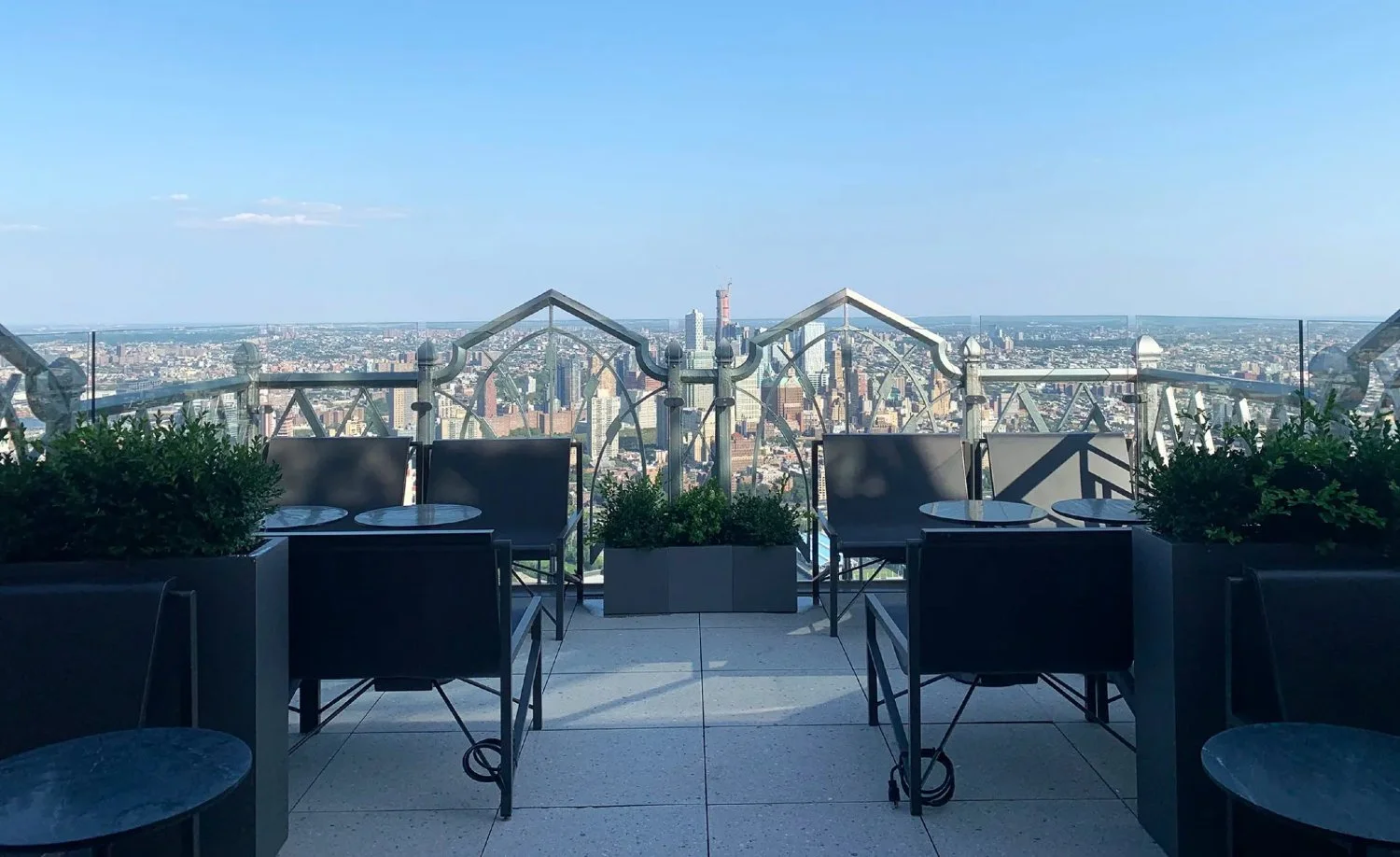 Minimalist rooftop terrace at Saga in Manhattan overlooking the skyline, offering a private and elevated setting for exclusive dining experiences