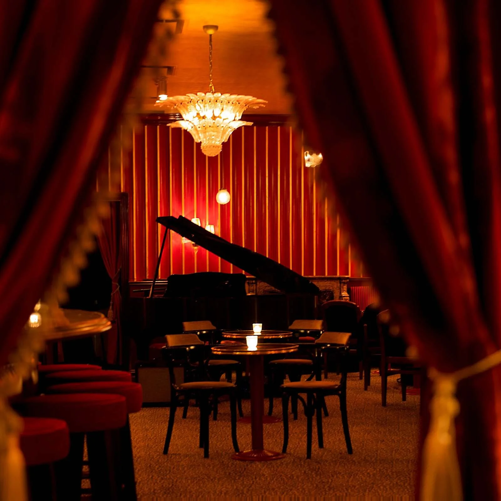Piano in background of private lounge dining area