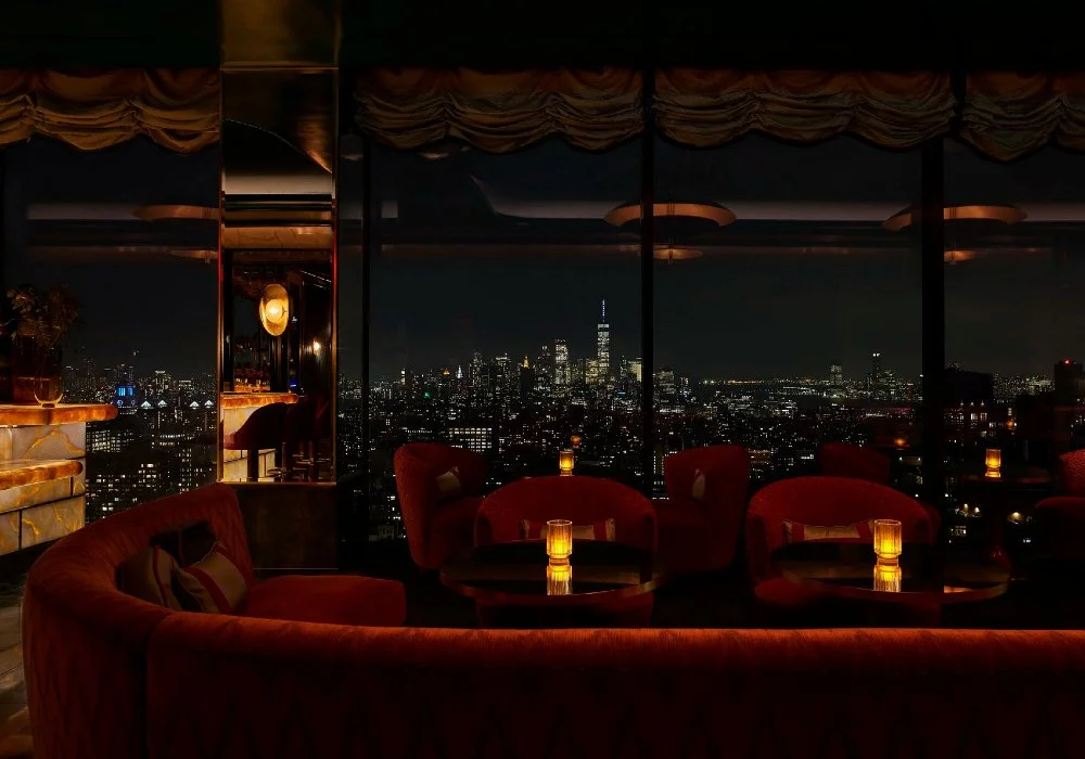 Nightime view of Manhattan skyline from Nubeluz rooftop
