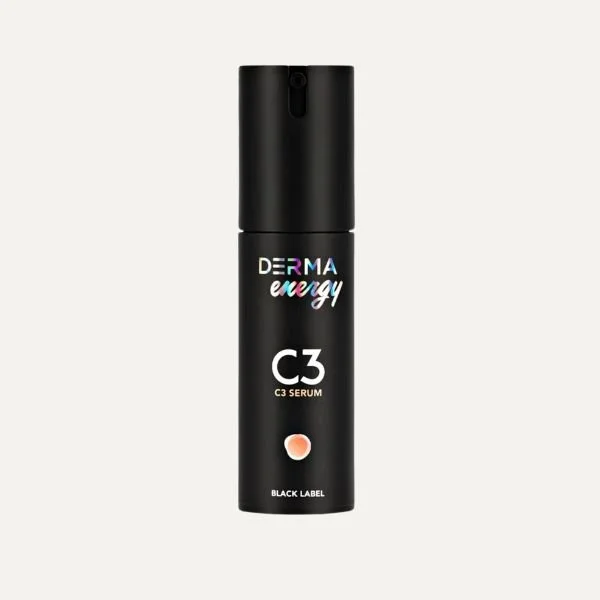 A black bottle of Derma Energy C3 Serum with a spray nozzle and colorful text that says "energy" on a plain background.