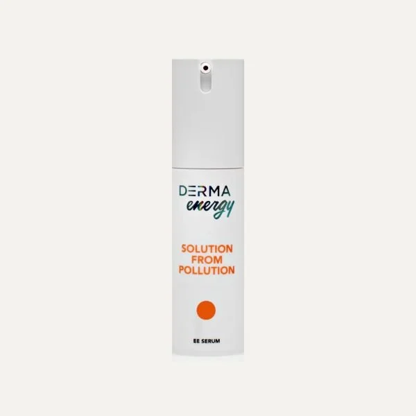 A white spray bottle labeled 'Derma Energy' with orange and black text, indicating it is an EE serum for pollution protection.
