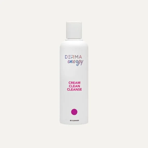 A white bottle of Derma Energy Cream Clean Cleanse face cleanser with a white cap, and pink and blue text on the label.