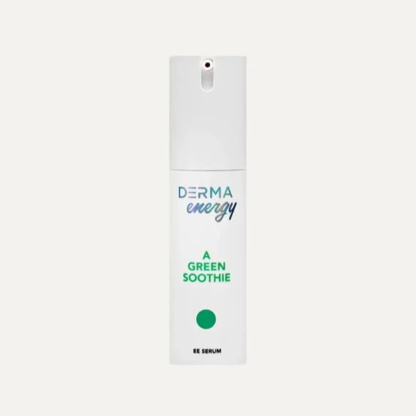 A white bottle of Derma Energy serum labeled as a green soothing anti-aging serum with a spray nozzle.