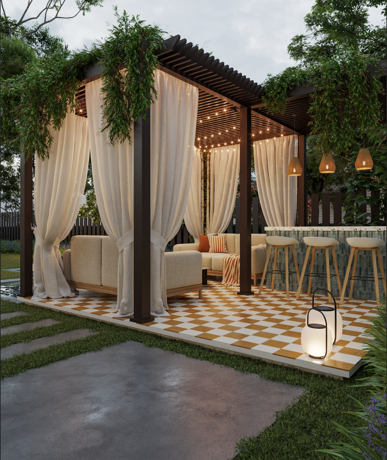 Outdoor patio with a pergola featuring cream curtains, string lights, and hanging lanterns. There is a beige outdoor sofa with orange and striped pillows, a high counter with three bar stools, and a checkered tile floor surrounded by green grass and 
