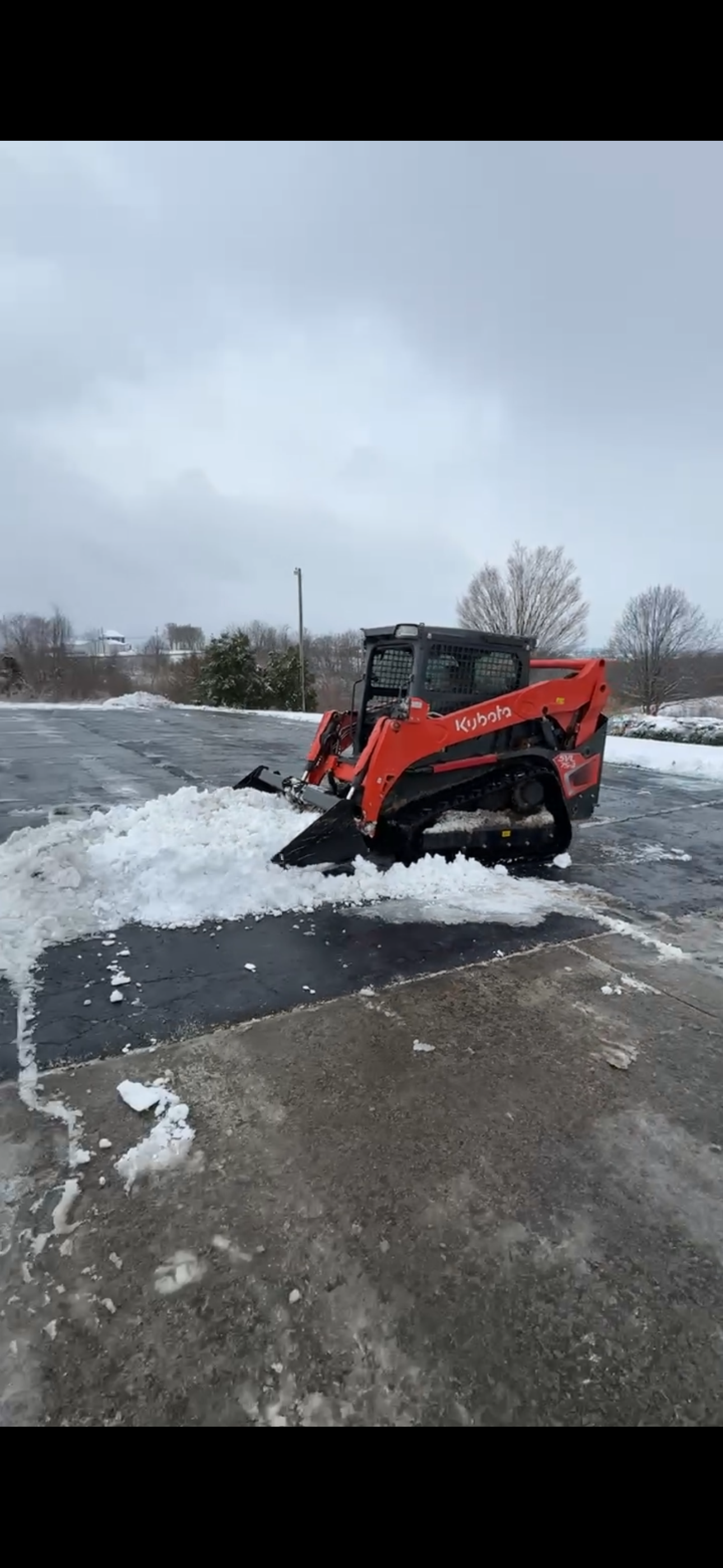 Kentucky Legacy Construction Skid steer working on a snow removal project