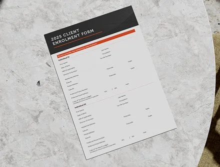 A printed 2025 client enrollment form on a light gray textured surface.