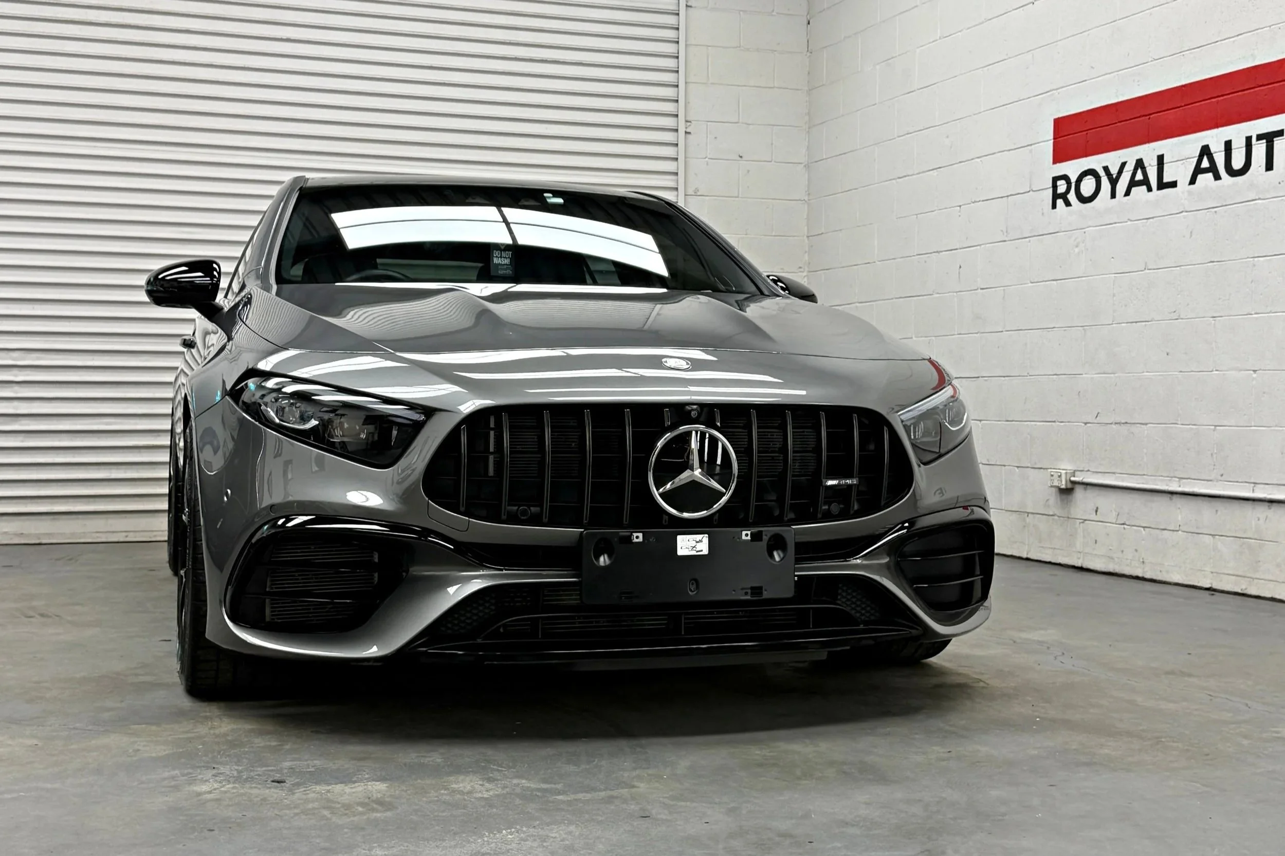 Grey Mercedes-AMG A45 S showing its finished paintwork at Royal Automotive Care’s Southport studio.