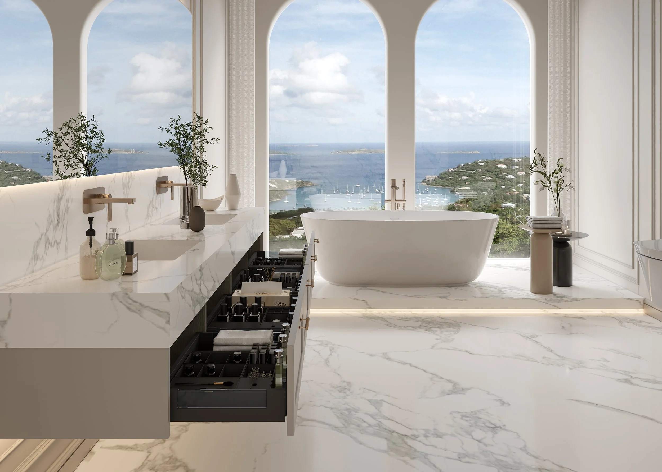 Modern bathroom with large windows offering a scenic ocean view, featuring a freestanding bathtub, marble floors and countertops, and minimal decor.