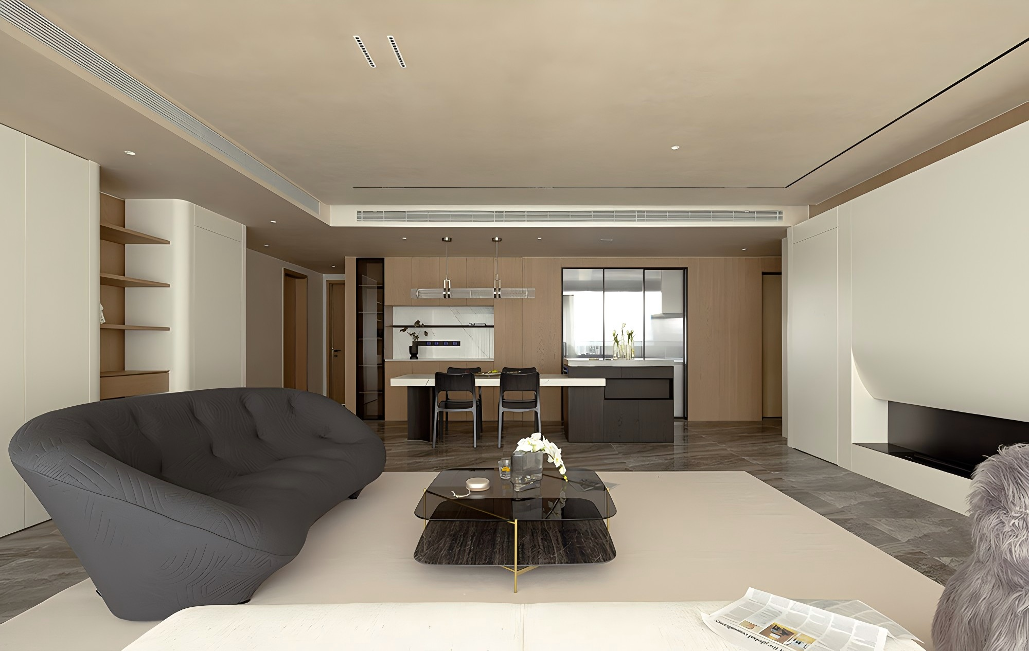 Modern open-plan living room and kitchen with black sofa, glass coffee table, and dining area in a minimalist style.