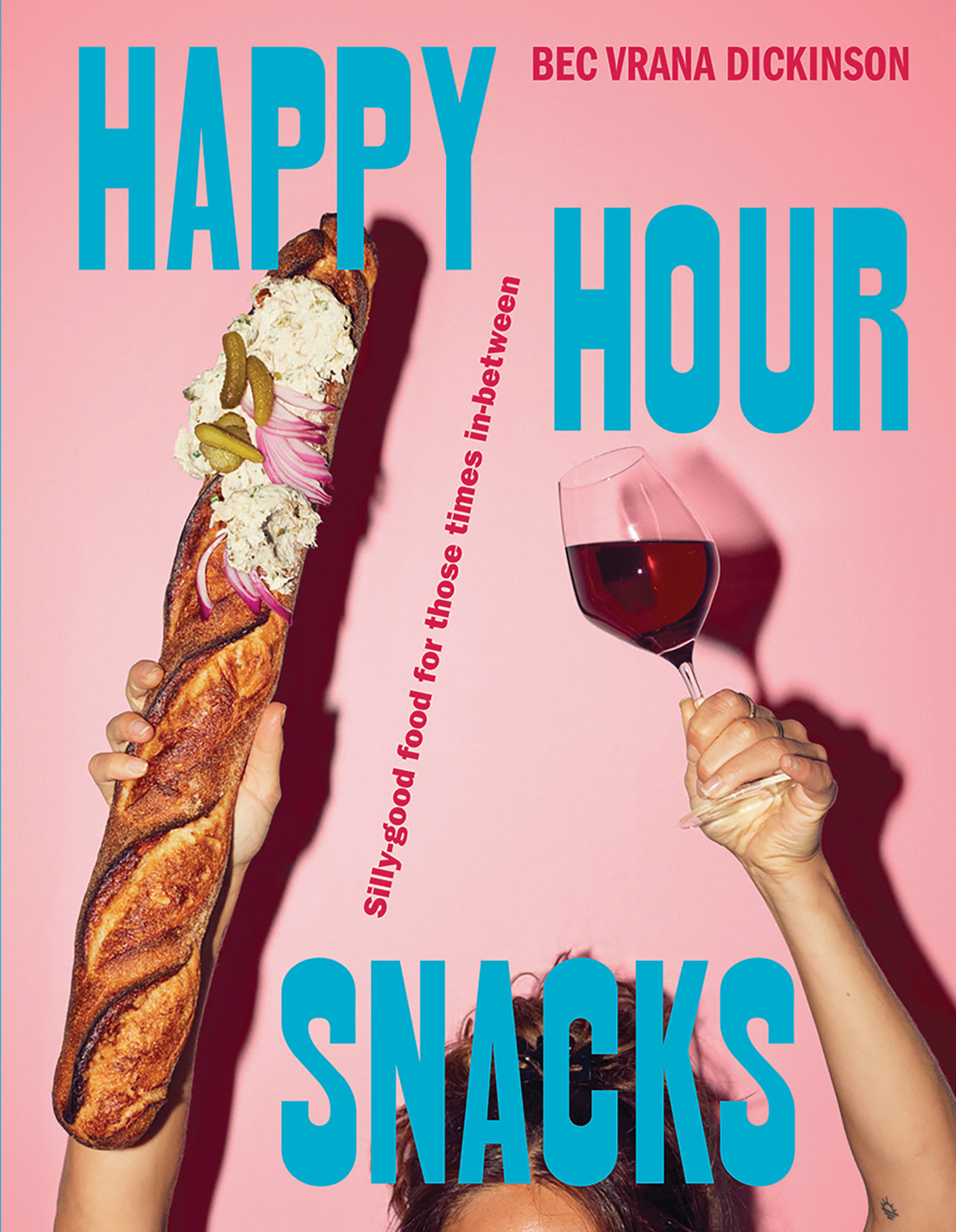 People holding a large sausage sandwich and a glass of red wine against a pink background, with blue and red text overlaying the image.