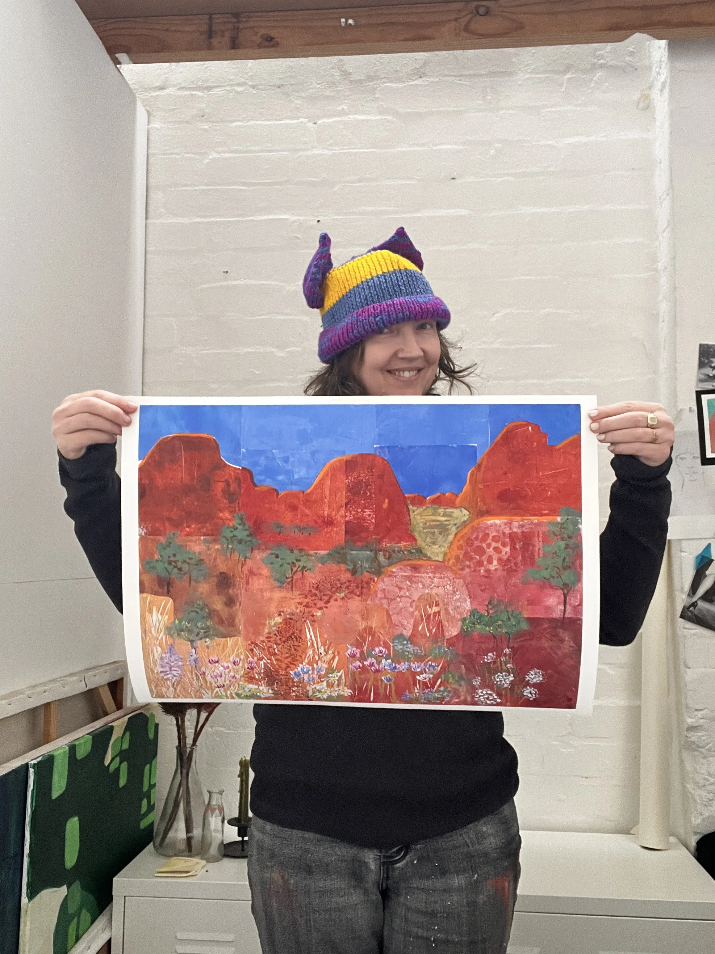 Artist Aprill Enright with the No Photographs Allowed print
