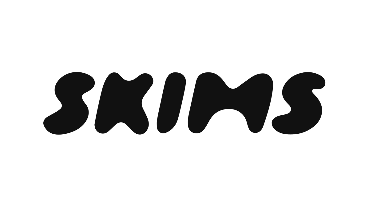 The word 'SKINS' written in bold, stylized black font on a white background.
