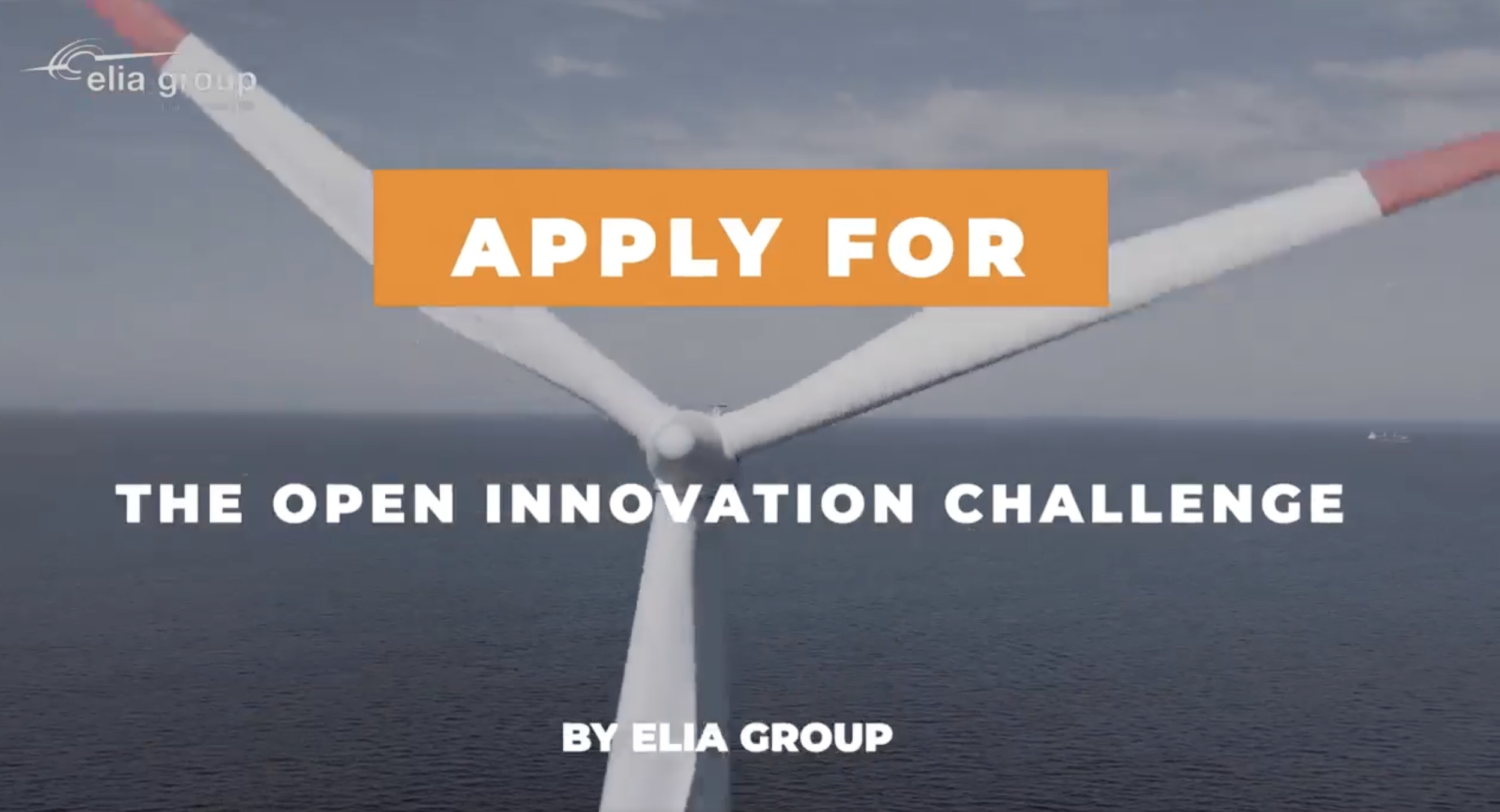 A wind turbine at sea with wind turbine blades, overlaid with text promoting an innovation challenge by Elia Group.