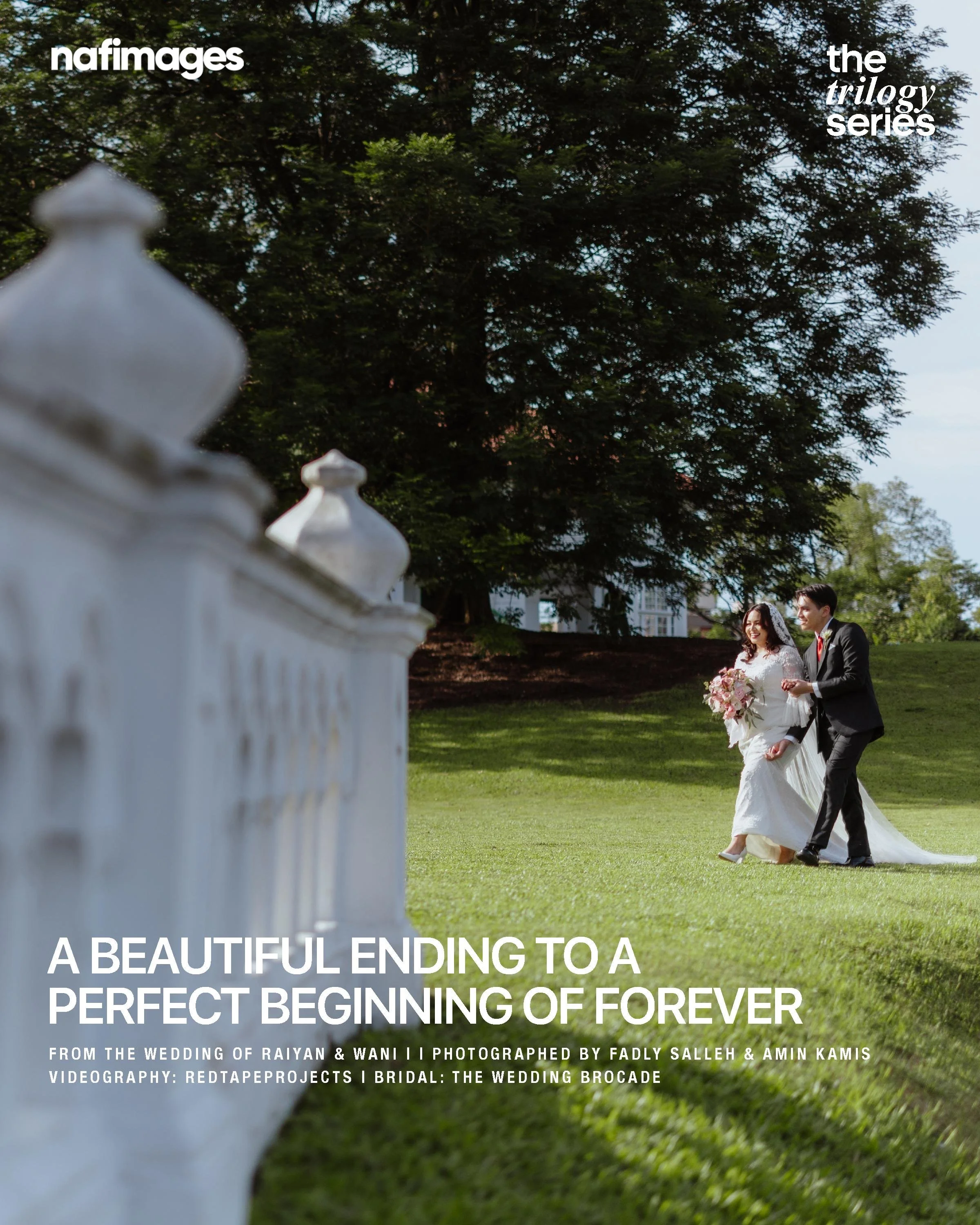 A bride and groom walking outdoors on a grassy area, with the bride holding a bouquet, while a decorative white fence is in the foreground.