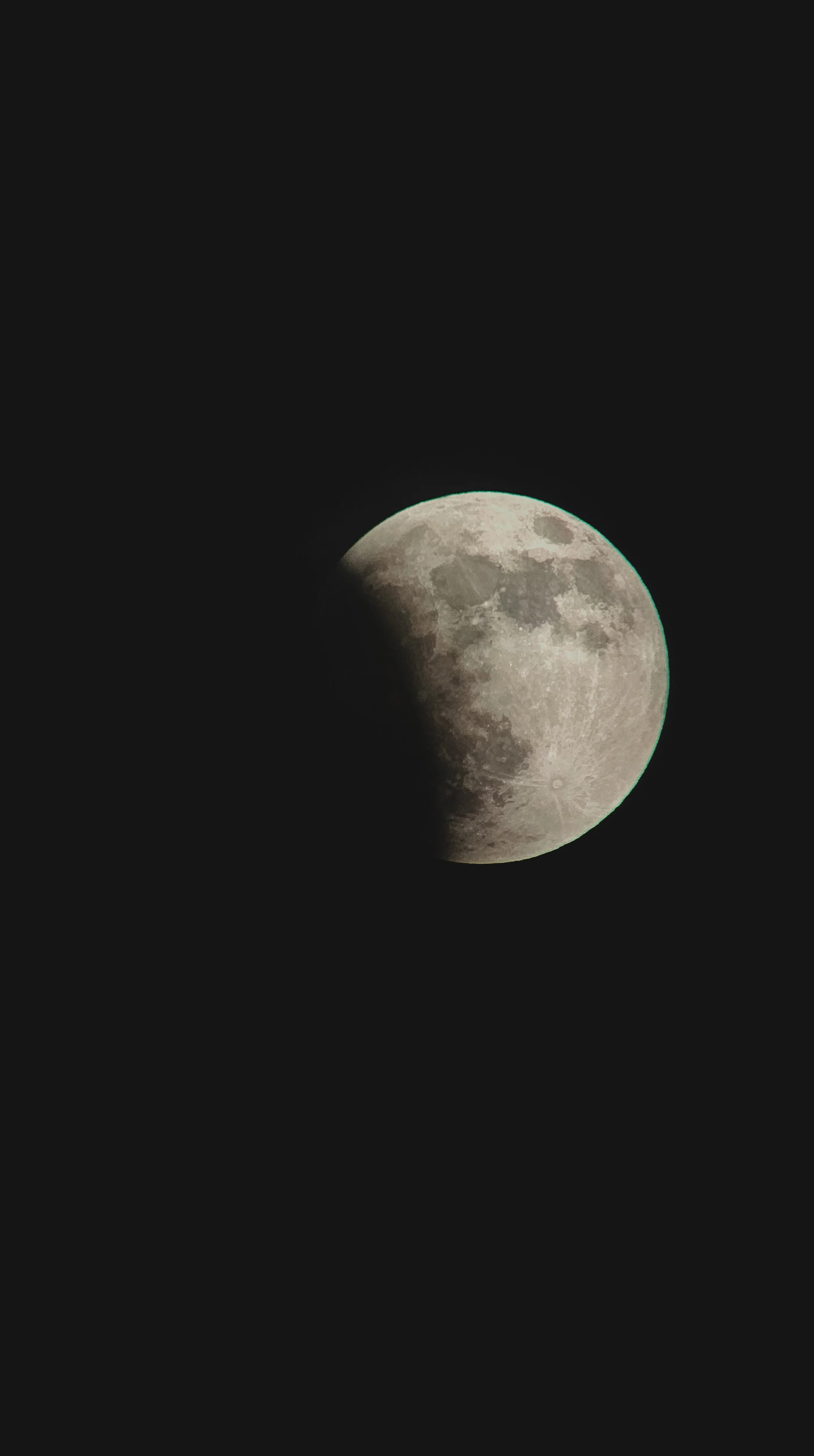 Photograph of the moon showing gibbous phase with shadow on the left side.