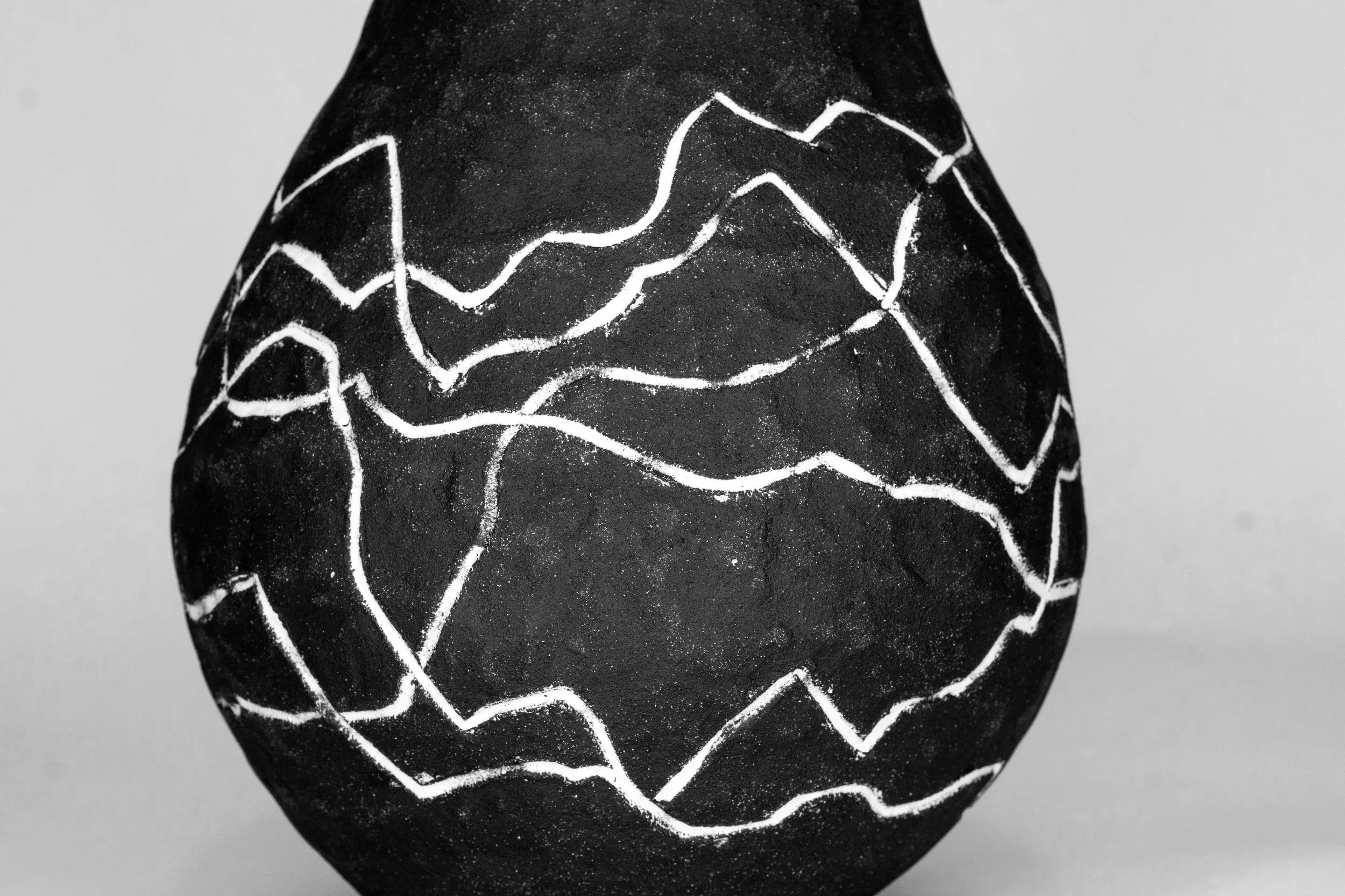 A close up photo of my sculpture titled 017 highlighting the white inlay