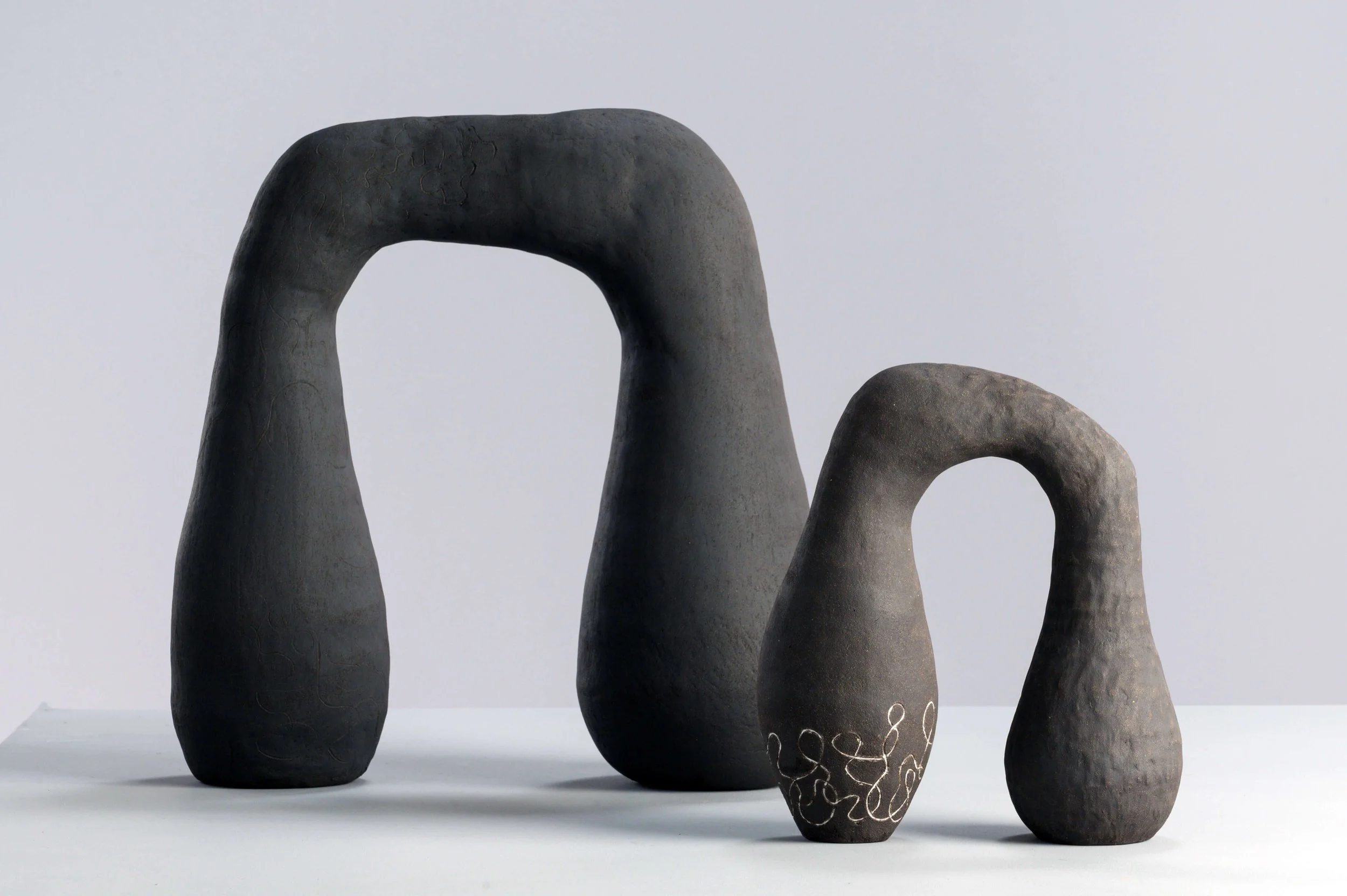 A photo of two of my sculptures from my Vex and Rapture collection