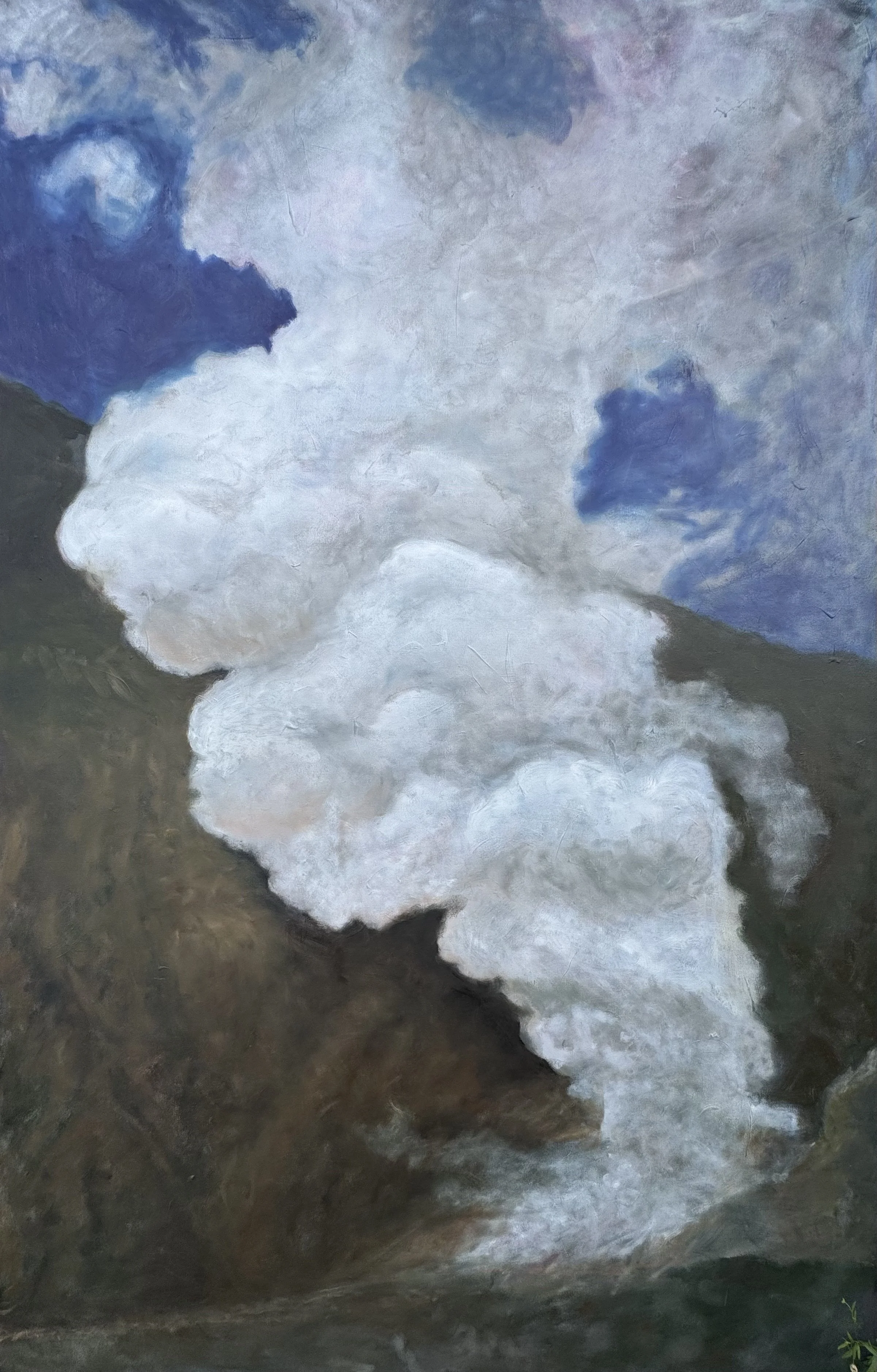 A cloud of white steam rising from a volcanic vent or hot spring surrounded by dark volcanic rock, under a partly cloudy sky.