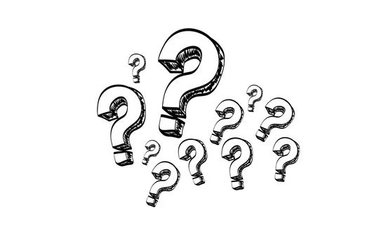 Multiple black and white question marks of different sizes on a white background.