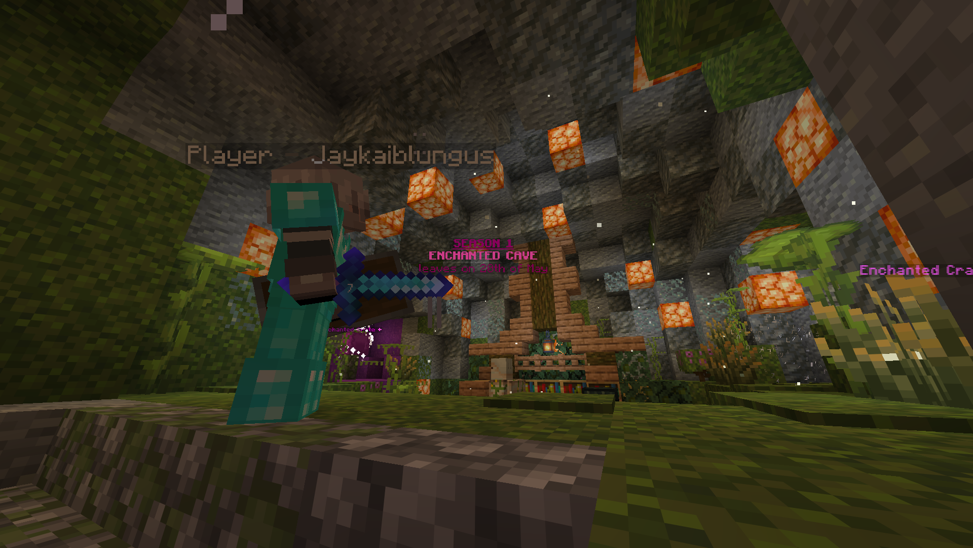 Minecraft game scene inside an enchanted cave with glowstone lighting, a character in diamond armor holding a sword, and signs indicating a seasonal event and enchanted cave.