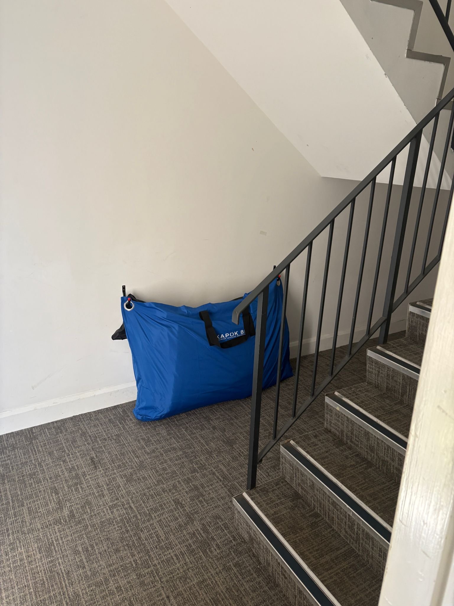 Blue bag at the bottom of stairs