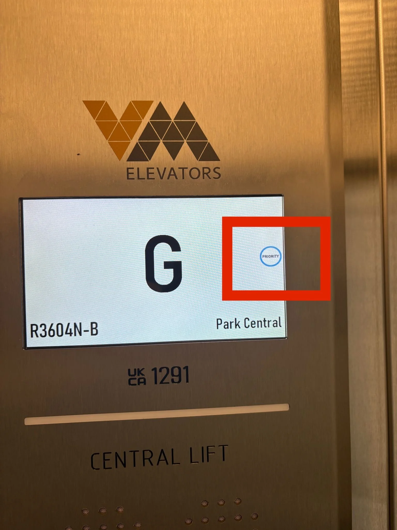 Lift display screen with Priority sign highlighted in a red box