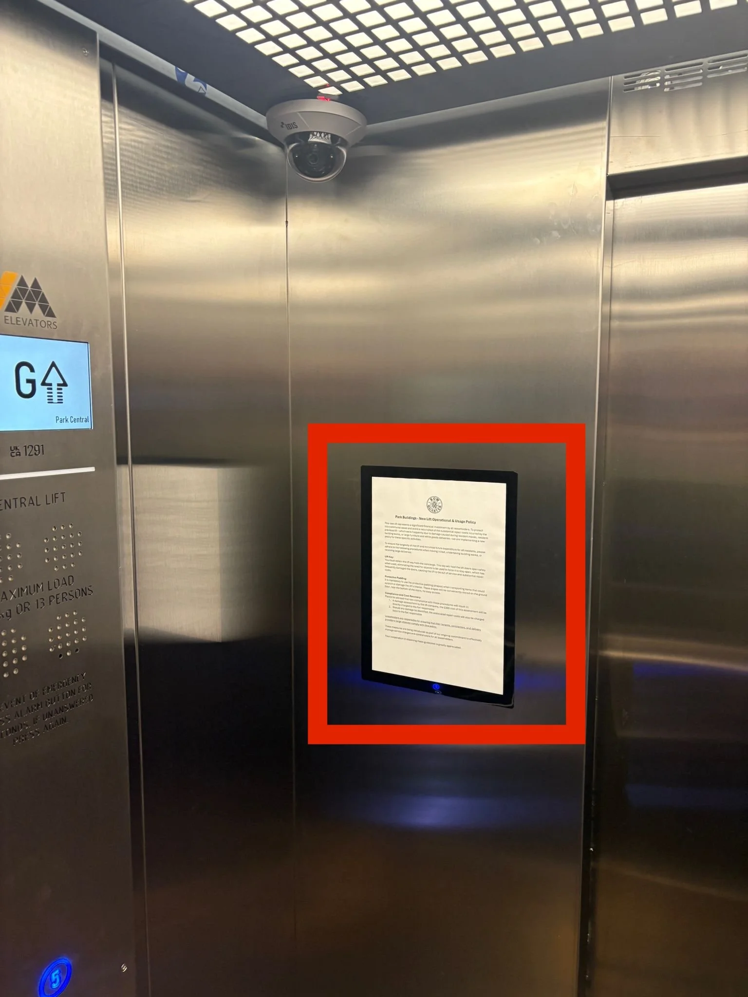 Lift policy on the wall of a lift, highlighted in red
