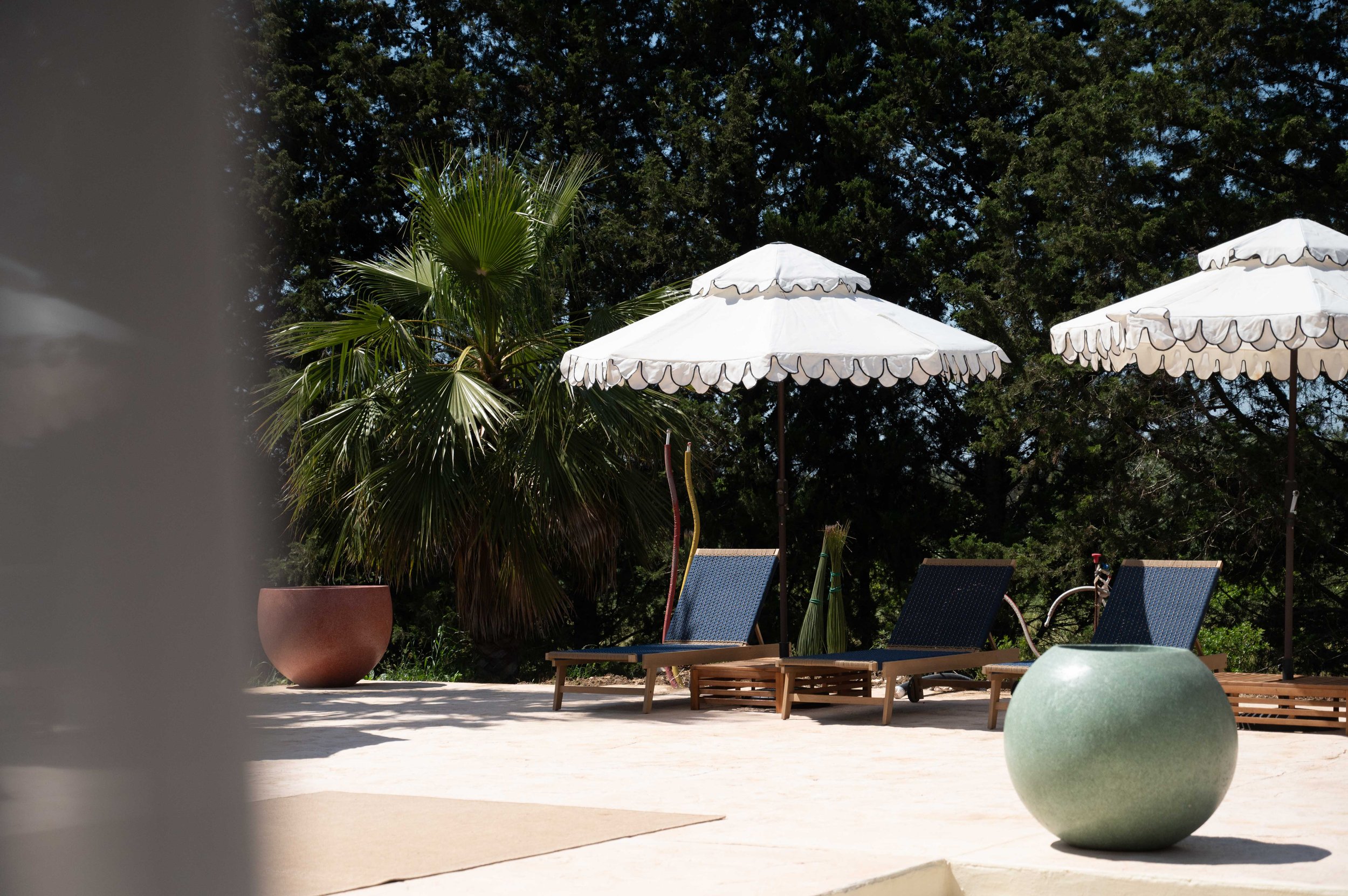 Poolside lounge area at Masseria Coucou
