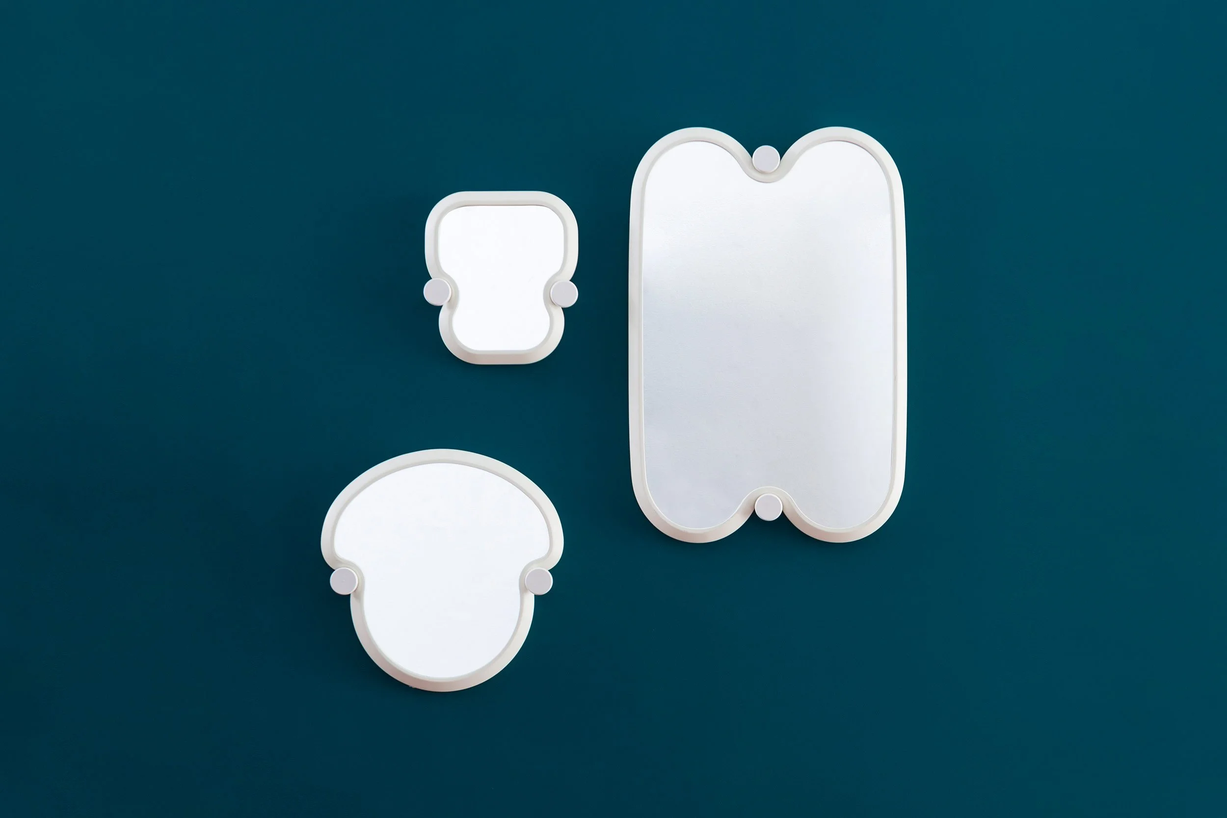 3 wall mirrors with different outlines