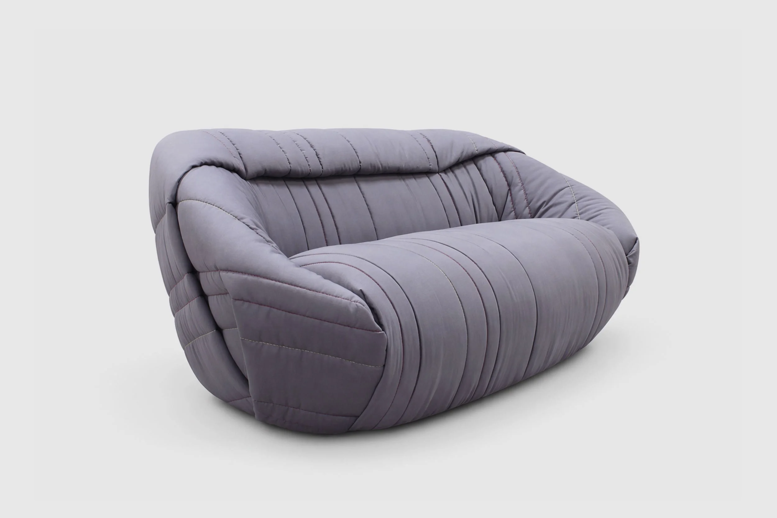 Sofa made of a large folded quilt