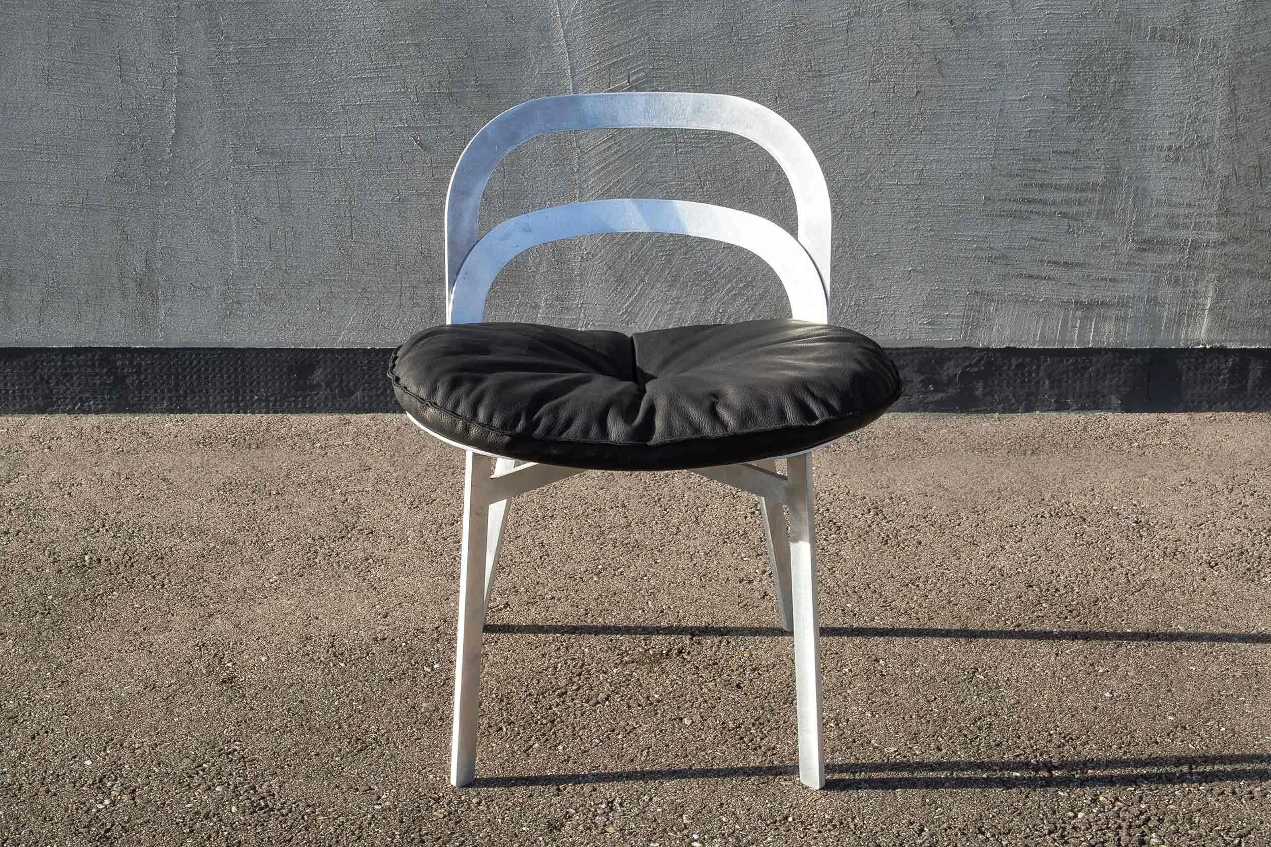 Cut chair made of raw aluminium
