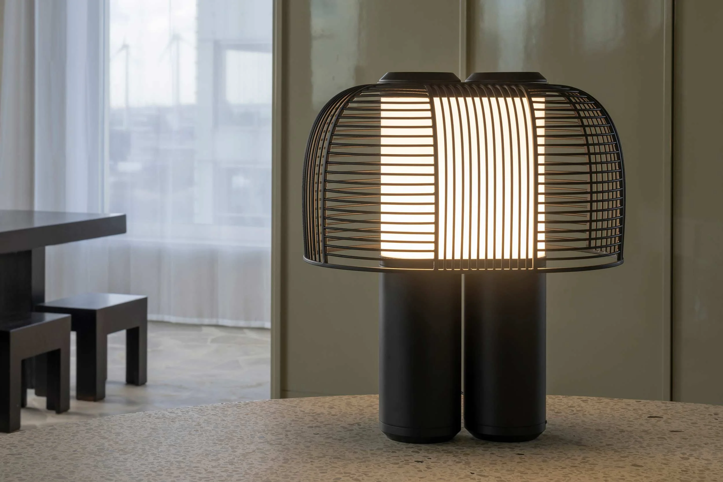 Yasuke table lamp with two legs and a wire lampshade