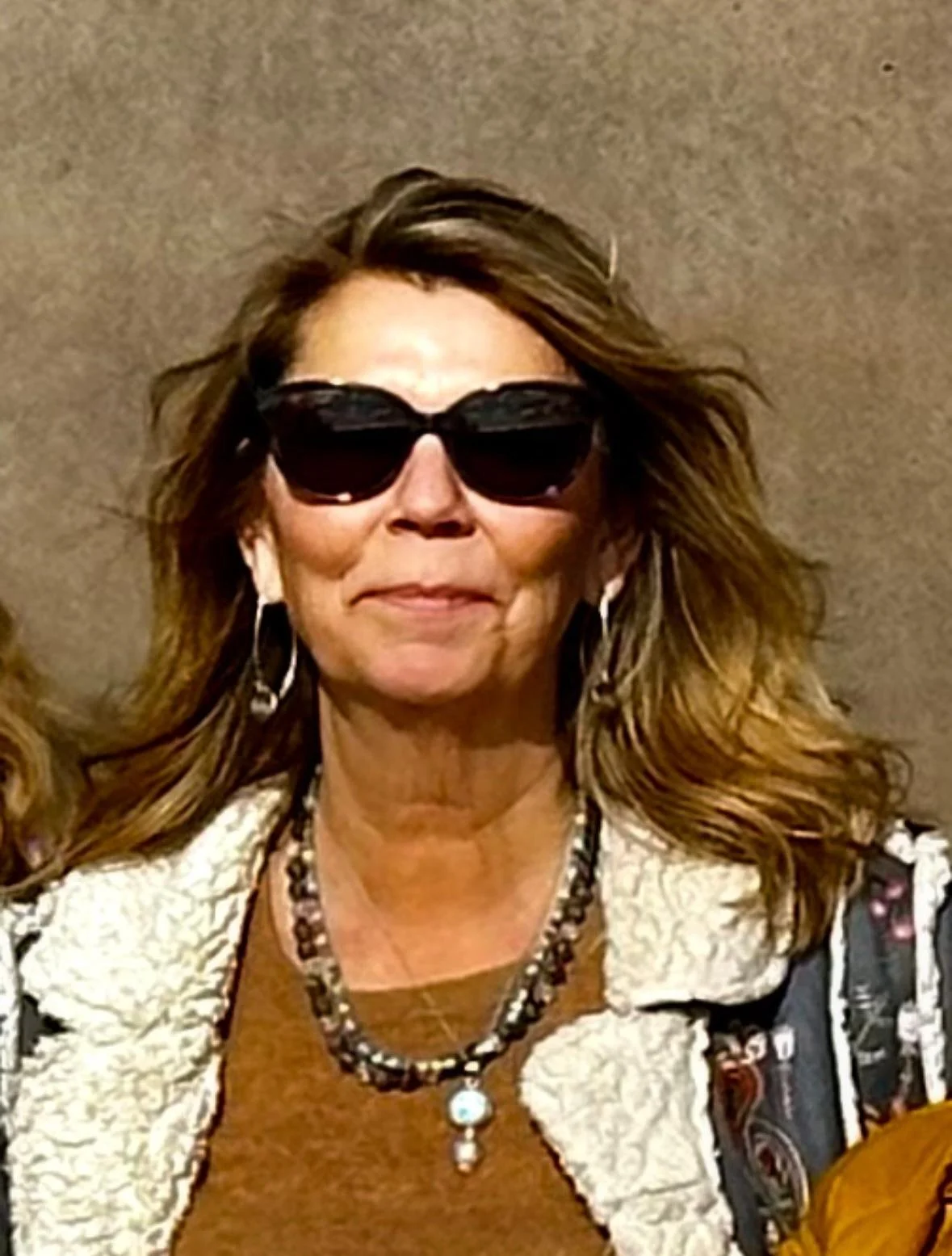 Review of a woman wearing necklace.