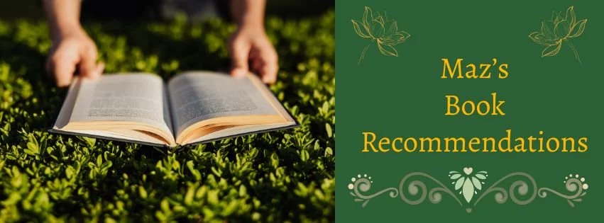 An open book resting on green plants outdoors, with a green banner that says "Maz's Book Recommendations" in yellow text and decorative floral and swirly designs.