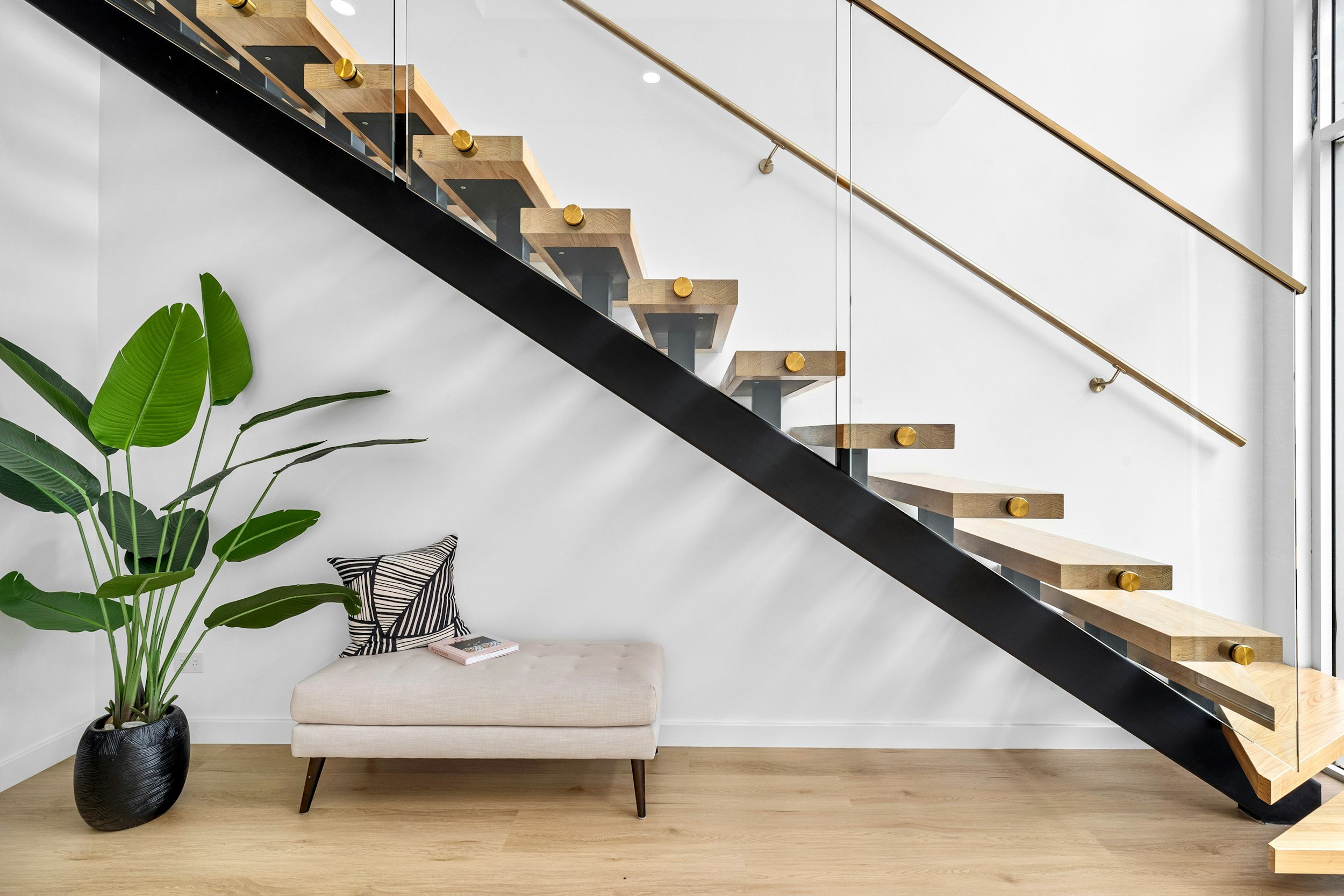 bespoke steel framed staircase with wooden runs and glass framework by Gemfabs Nottinghamshire.