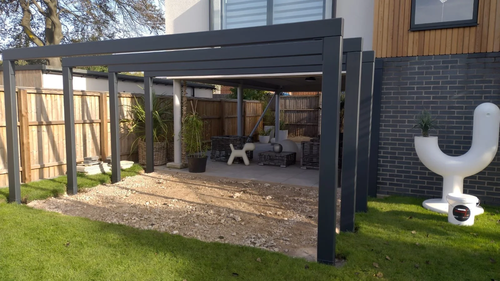  black metal pergola structure designed and installed by Gemfabs. Nottinghamshire steel fabricators
