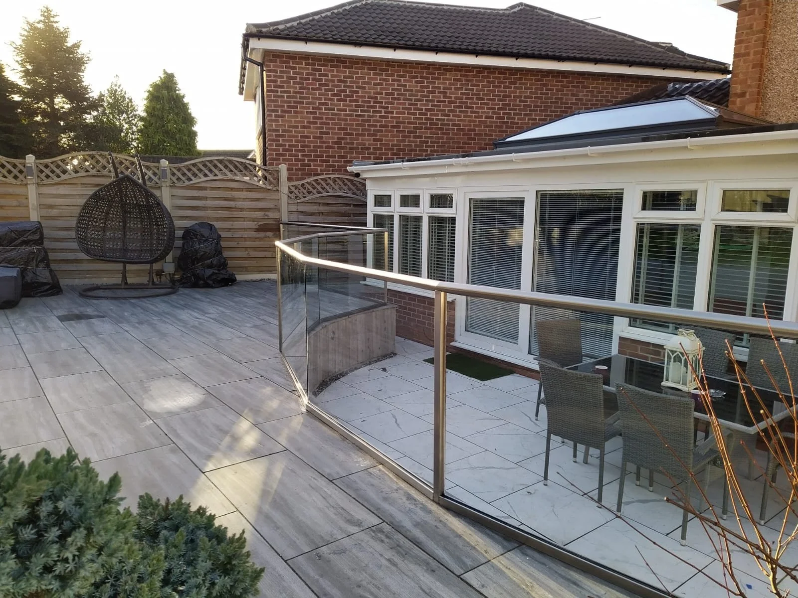A modern outdoor patio with bespoke metal railings by nottinghamshire steel fabricators Gemfabs