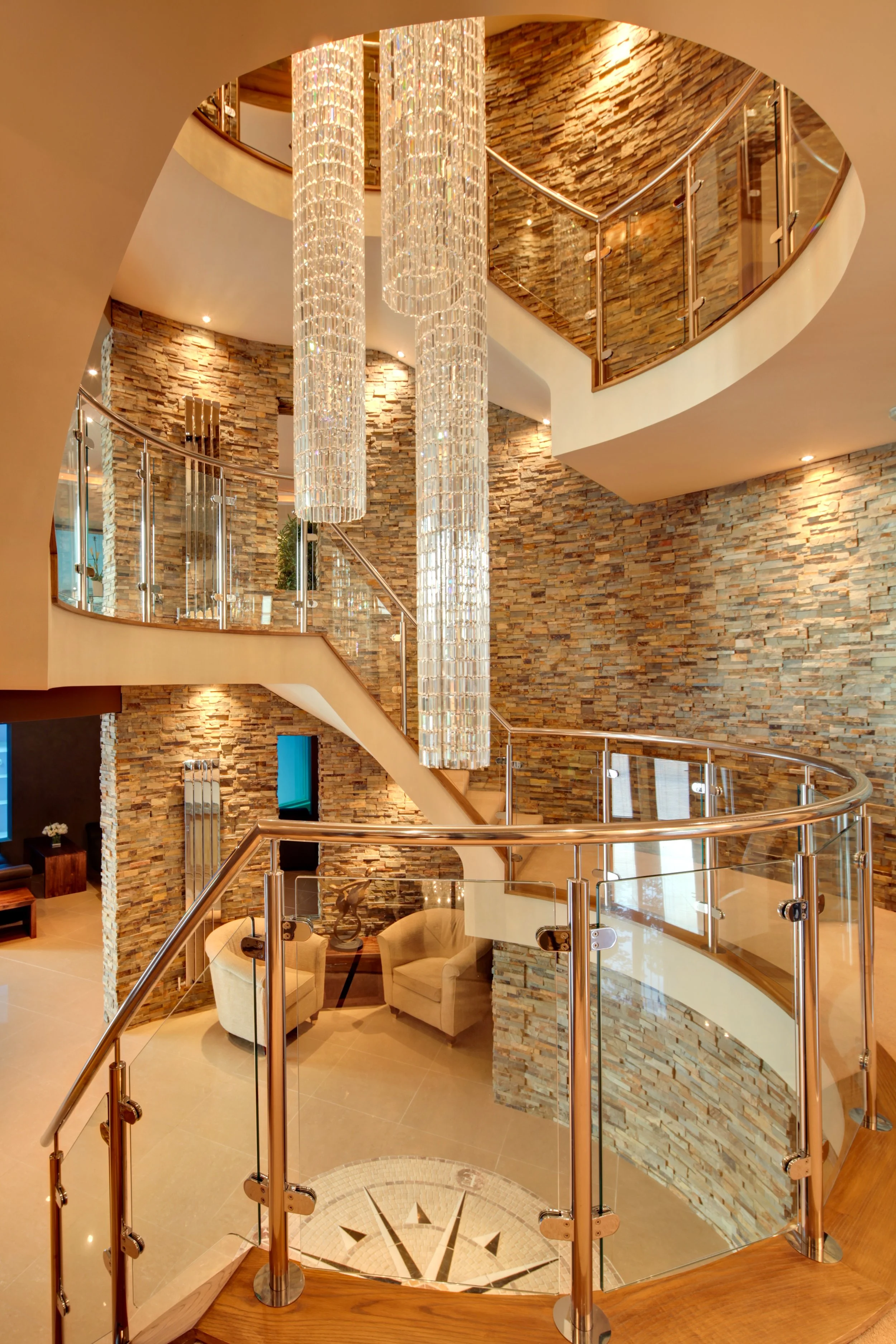 Contemporary stainless steel staircase and railings for residential property by Gemfabs