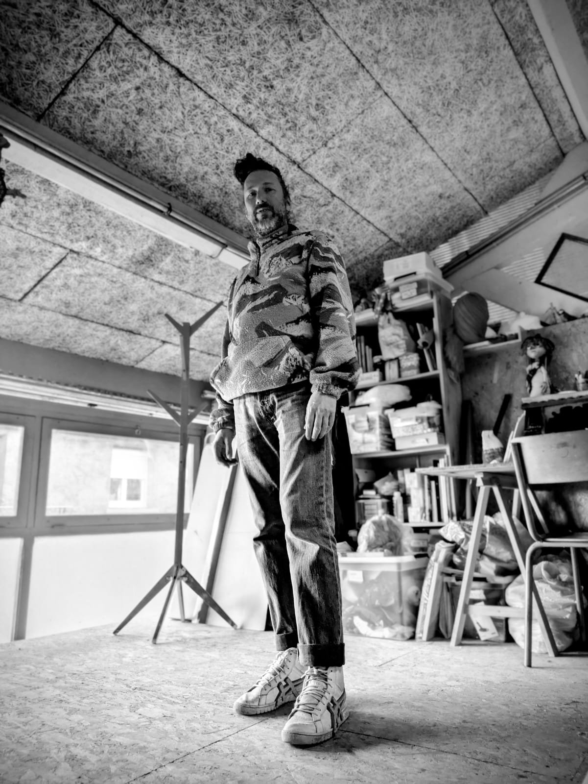 man black and white photography stand up in a french artist atelier in Lyon