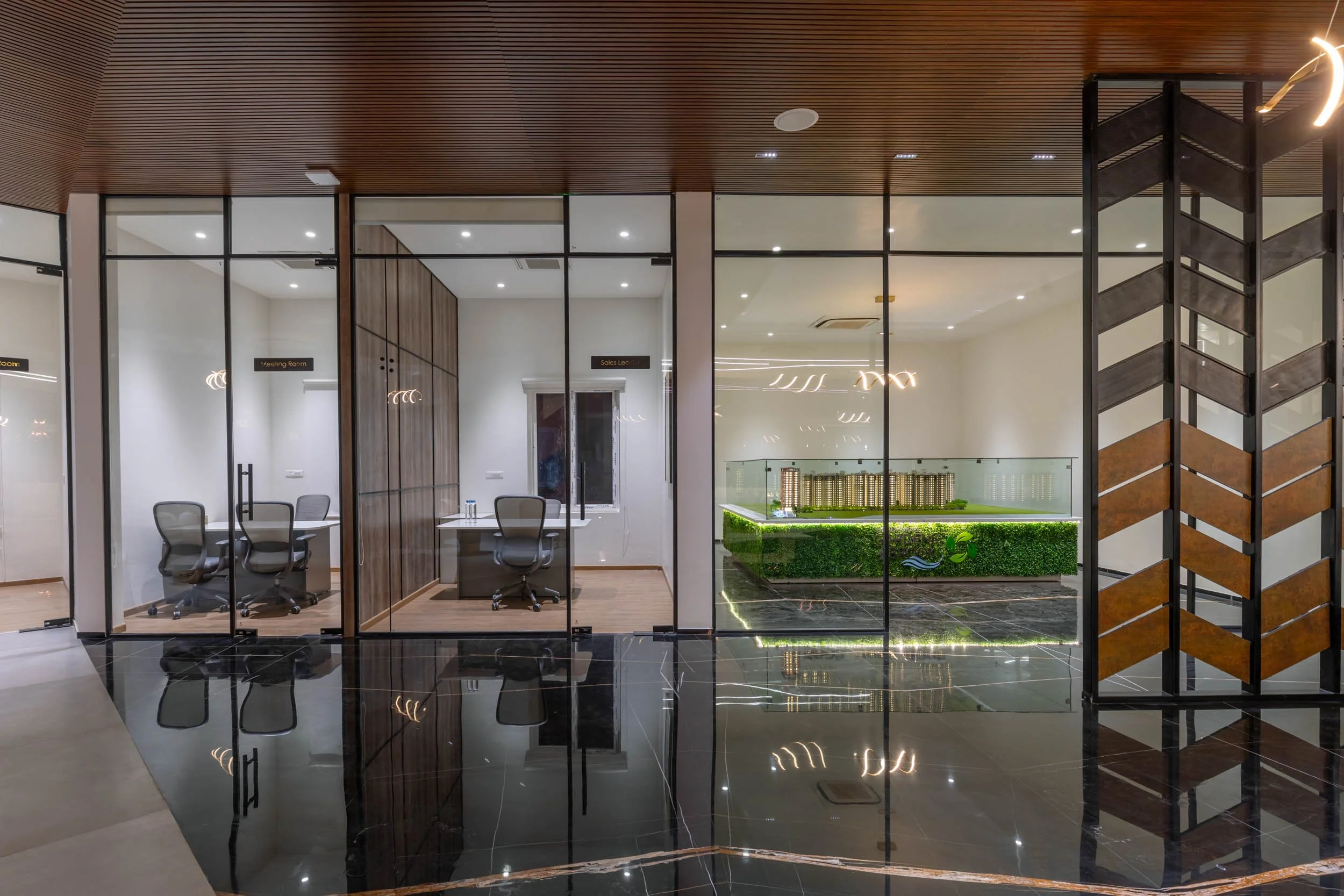 nterior commercial architecture photography showcasing a modern corporate office with floor-to-ceiling glass partitions and contemporary wood finishes.
