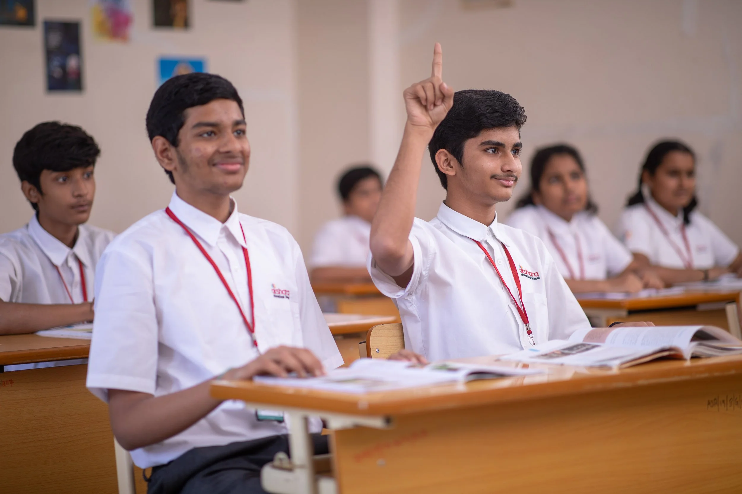 Interior school photography of engaged students participating in a classroom lesson at a modern educational institution