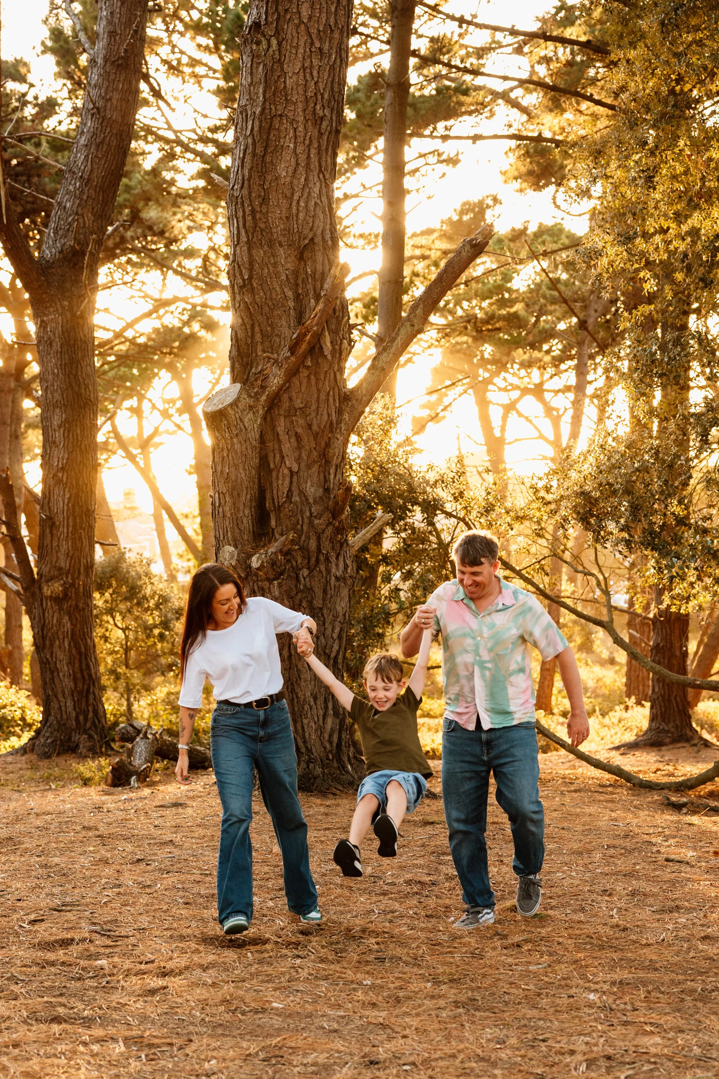 Family photography session in a Mississauga park with parents and children spending time together