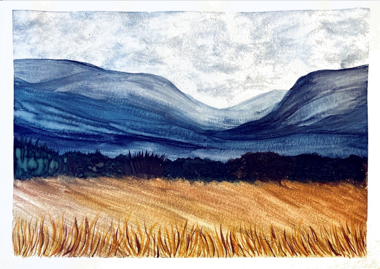 Watercolor painting of a landscape with mountains in shades of blue, a dark tree line, and a golden field in the foreground